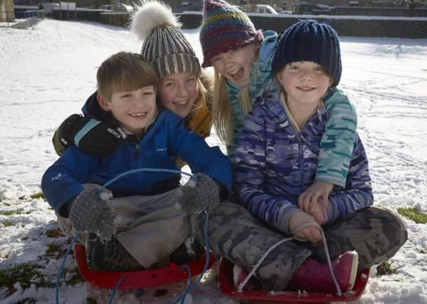 Calderdale in the Snow. Sledging fun for Bill Norman-McCall aged eight, Kitty Langlois aged nine, Matilda Norman-McCall aged nine and Amber Blackburn aged ten.