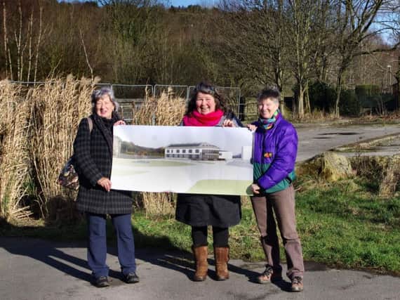 Members of the Todmorden Strawbale Hotel Community Benefit Society unveil their idea