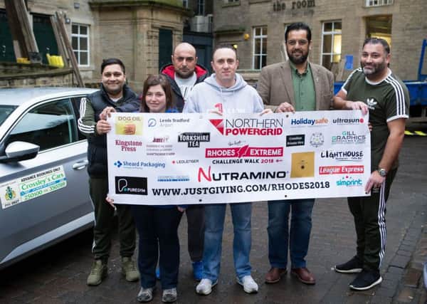 Ben Moorhouse and Gaynor Thompson, with sponsors Crossley Cars, Dean Clough, ready for the Rhodes Extreme Challenge Walk 2018