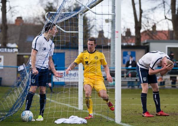 Action from the Guiseley v FC Halifax Town derby (Picture: Bruce Fitzgerald)