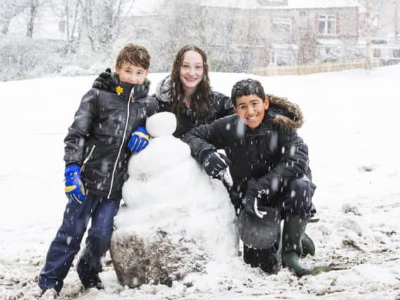 Fun in the snow at Crow Wood Park, Sowerby Bridge. From the left, Finn McKeown, nine, Mia McKeown, 14, and Ahmed Al-Kos, 10.