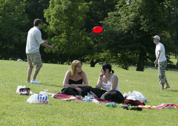 Visitors to Shibden Park enjoy the sunshine