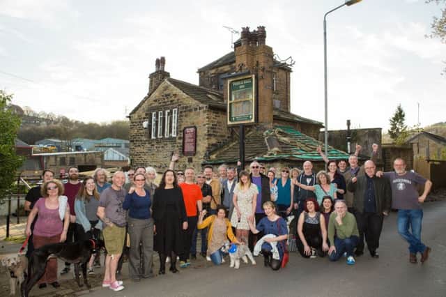 Puzzle Hall Community Pub supporters celebrate buying the historic Puzzle Hall Inn, Hollins Lane, Sowerby Bridge