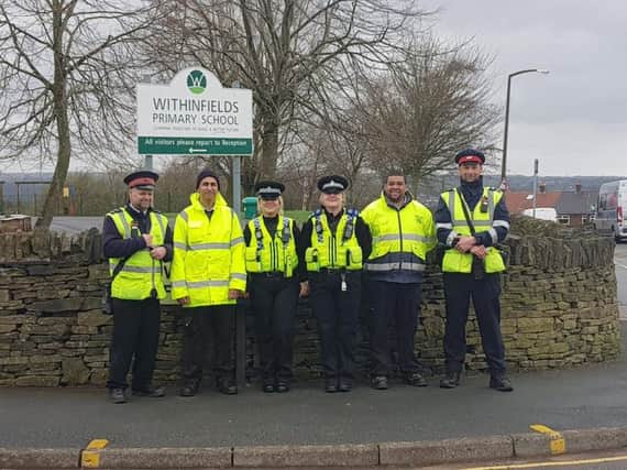 Tackling parking problems outside Withinfields School (Picture West Yorkshire Police)