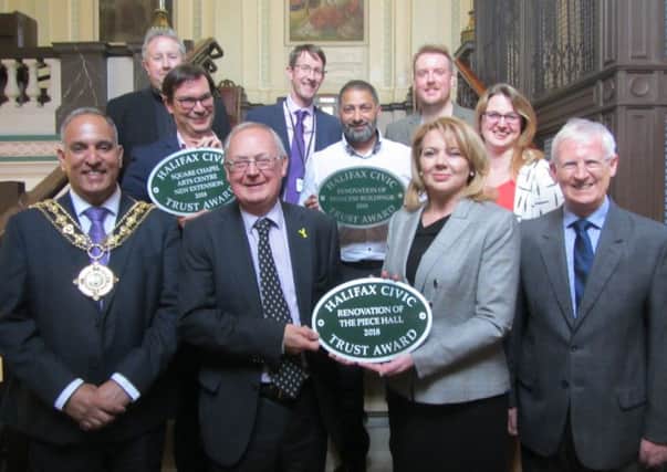Halifax Civic Trust award winners, including Calderdale Councils leader Councillor Tim Swift and Chief Executive of The Piece Hall, Nicky Chance-Thompson, front. Awards were presented by the Mayor, Councillor Ferman Ali, front left