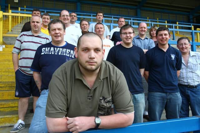 Gavin Butler (front) and local suport groups at a meeting at the Shay.