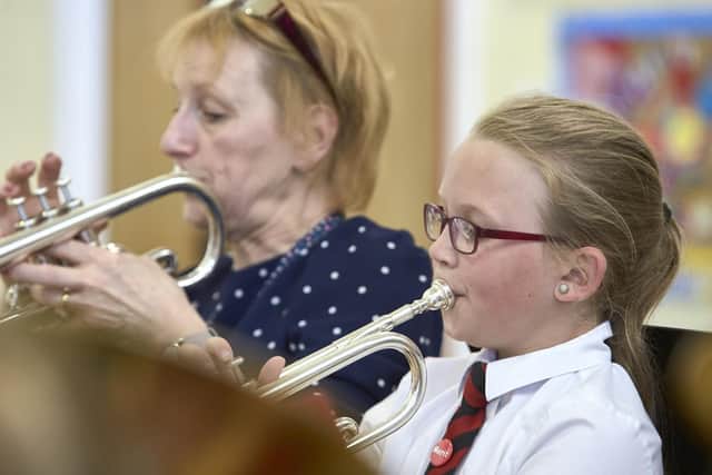 Band practice at Foxhill School, Queensbury. Ten year old Libby Richardson with head teacher Sally Hey.